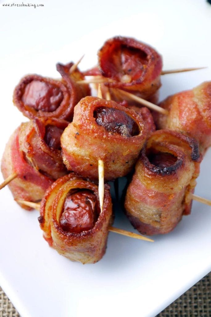 Bacon Wrapped Kielbasa: Smoky kielbasa wrapped in thick cut bacon is complemented by a slightly sweet and spicy mustard glaze. | stressbaking.com