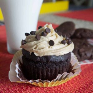 Chocolate cupcake with cookie dough frosting topped with mini chocolate chips