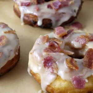 Maple bacon donuts on parchment paper