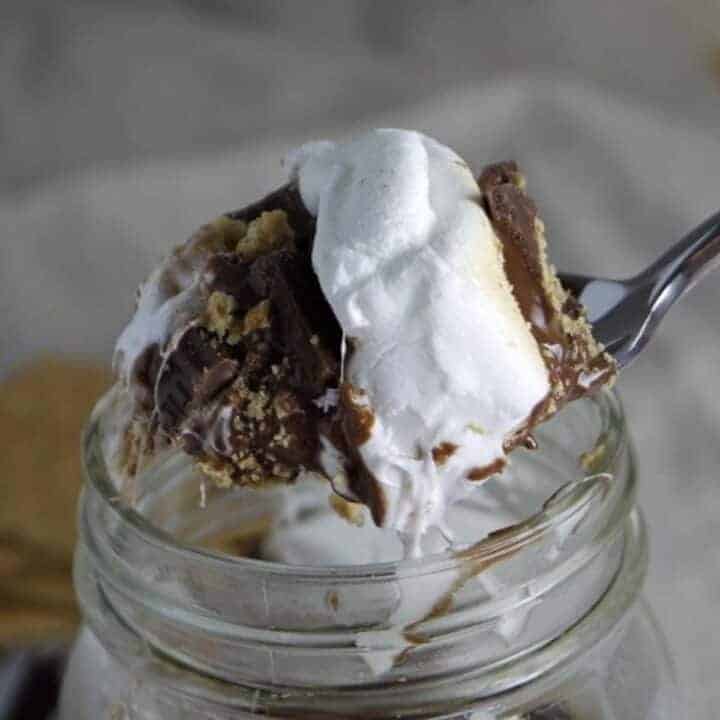 A spoonful of melted chocolate, marshmallow and graham cracker