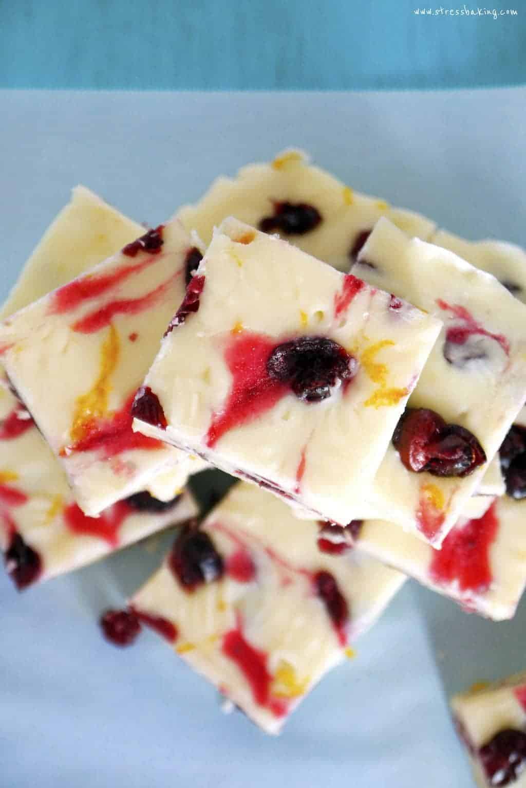 Cranberry Bliss Fudge: This no-bake white chocolate fudge is creamy and decadent, filled with cranberries and a hint of citrus! | stressbaking.com #stressbaking #holidays #cranberries #christmas #fudge