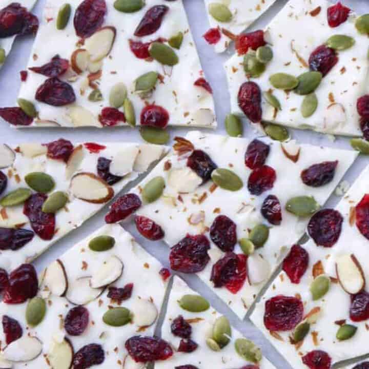 White chocolate bark covered in dried cranberries and nuts, broken into pieces