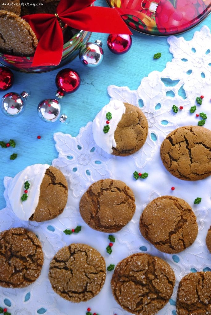 Chewy Ginger Molasses Cookies: These chewy cookies are packed with ginger and molasses, with a subtle sweetness to satisfy your sweet tooth. Dip them in white chocolate and decorate with sprinkles for some holiday flair! | stressbaking.com