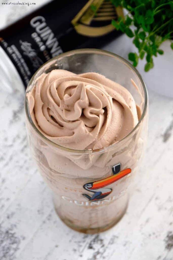 Chocolate Guinness Whipped Cream: Unbelievably creamy chocolate whipped cream with a subtle yet distinctive flavor of Guinness malt. Looks just like the foamy head on a pint! This boozy whipped cream will be your new favorite! | stressbaking.com