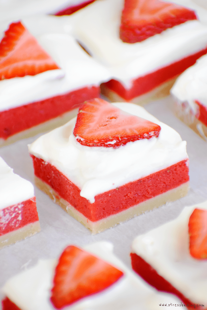 Close up of a vibrant red and white strawberry rhubarb bar