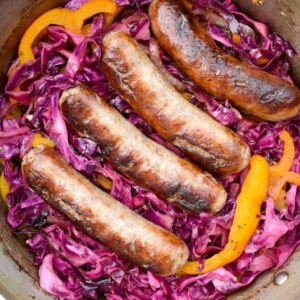 Bratwurst and Red Cabbage: Smoky sauteed vegetables are combined with sweet and sour red cabbage to make the perfect partner to juicy, flavorful beer-soaked bratwurst! | stressbaking.com