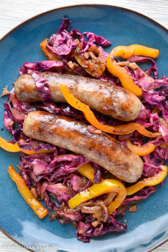 Bratwurst and Red Cabbage: Smoky sauteed vegetables are combined with sweet and sour red cabbage to make the perfect partner to juicy, flavorful beer-soaked bratwurst! | stressbaking.com