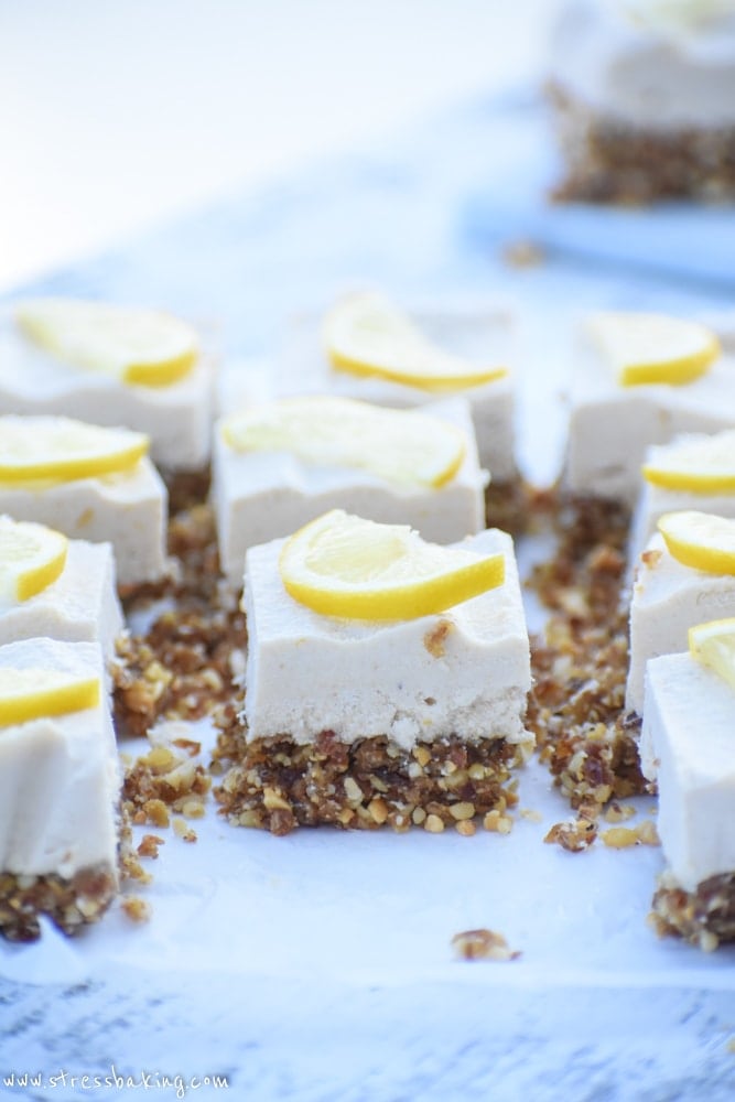 Raw Lemon Cheesecake Bars: A creamy, rich, lemony coconut cashew cream filling sits atop a naturally sweetened nut crust for the perfect healthy dessert! 