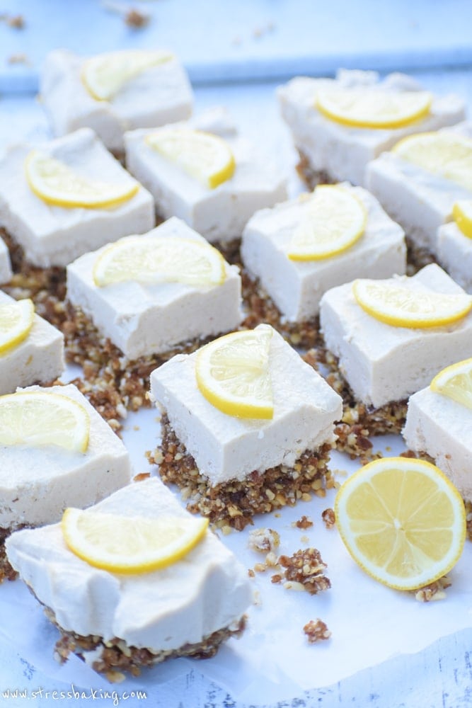 Raw Lemon Cheesecake Bars: A creamy, rich, lemony coconut cashew cream filling sits atop a naturally sweetened nut crust for the perfect healthy dessert! 