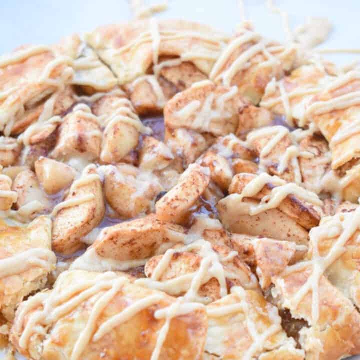 Close up of an apple galette with maple icing drizzle