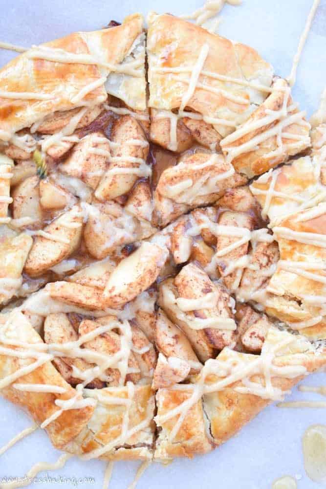 Paleo Apple Galette: Tart apples combine with the sweet flavors of cinnamon, honey and coconut sugar, a crispy gluten free crust and a slightly nutty maple drizzle for the perfect fall dessert! | stressbaking.com