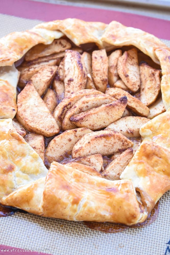 Paleo Apple Galette: Tart apples combine with the sweet flavors of cinnamon, honey and coconut sugar, a crispy gluten free crust and a slightly nutty maple drizzle for the perfect fall dessert! | stressbaking.com