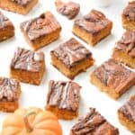 Nutella pumpkin pie bars on a white counter
