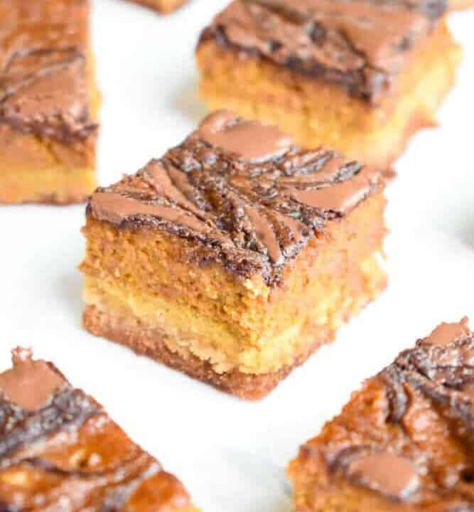 Paleo Nutella Swirled Pumpkin Pie Bars: The perfect alternative to pumpkin pie! Homemade Nutella swirl through a thick layer of pumpkin pie filling, sitting atop a shortbread crust - you won't believe they're gluten free, dairy free, and paleo. | stressbaking.com