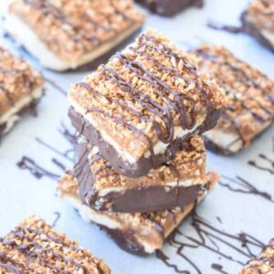 Paleo Samoa Bars: Soft shortbread, gooey caramel, and toasted coconut are dipped in chocolate and topped with a chocolate drizzle! | stressbaking.com