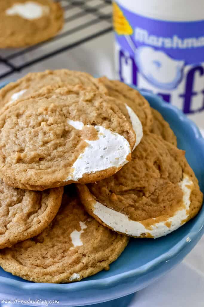 A pile of fluffernutter cookies on a blue cake plate