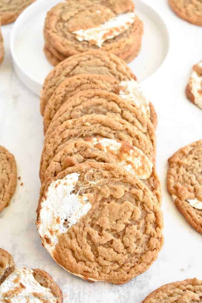 A stack of peanut butter cookies swirled with marshmallow fluff on its side