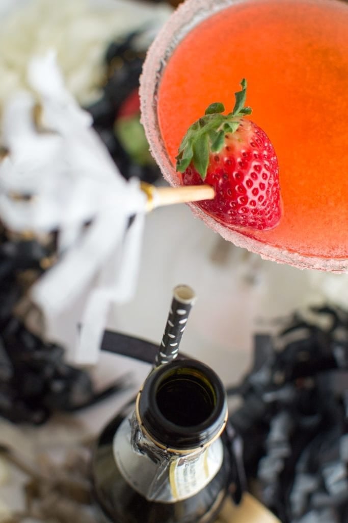 Sparkling Strawberry Martini: Muddled strawberries, simple syrup and vodka come together for a slightly sweet and smooth fruit martini. A champagne float contribute just the right amount of festive bubbles! | hungerthirstplay.com