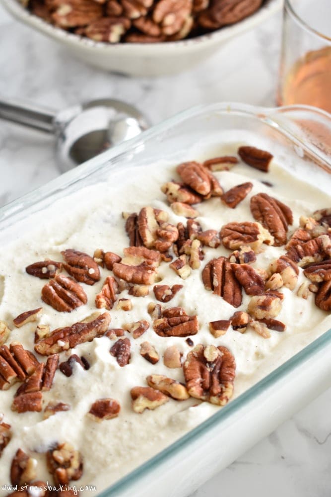 Bourbon Butter Pecan Ice Cream: Light, soft vanilla ice cream with a hint of bourbon flavor and loaded with buttery sweet roasted pecans. | stressbaking.com #icecream #boozydessert #boozy #butterpecan