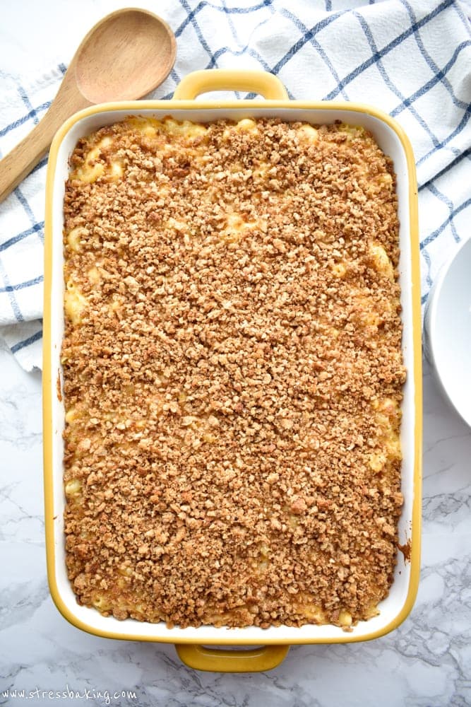 An overhead shot of baked mac and cheese topped with breadcrumbs in a casserole dish