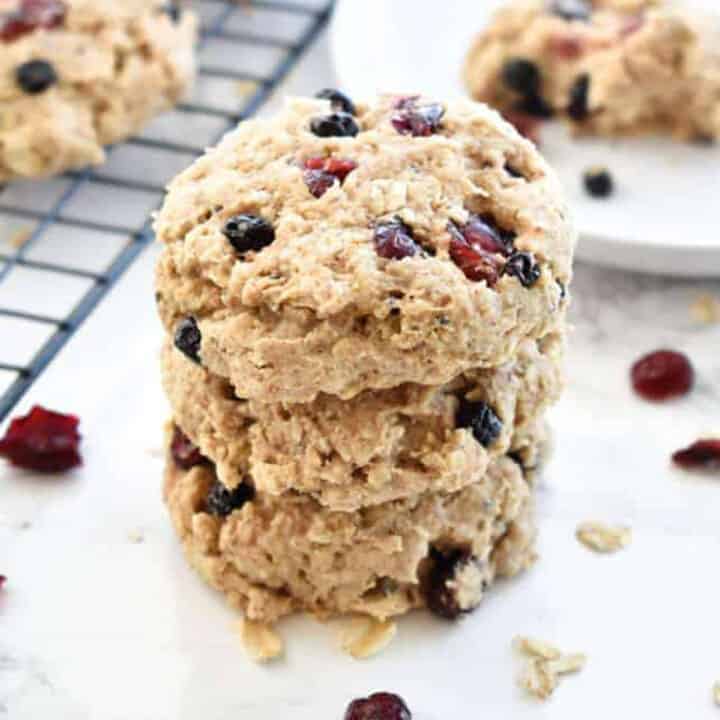 A stack of Banana Berry Breakfast Cookies on a white counter