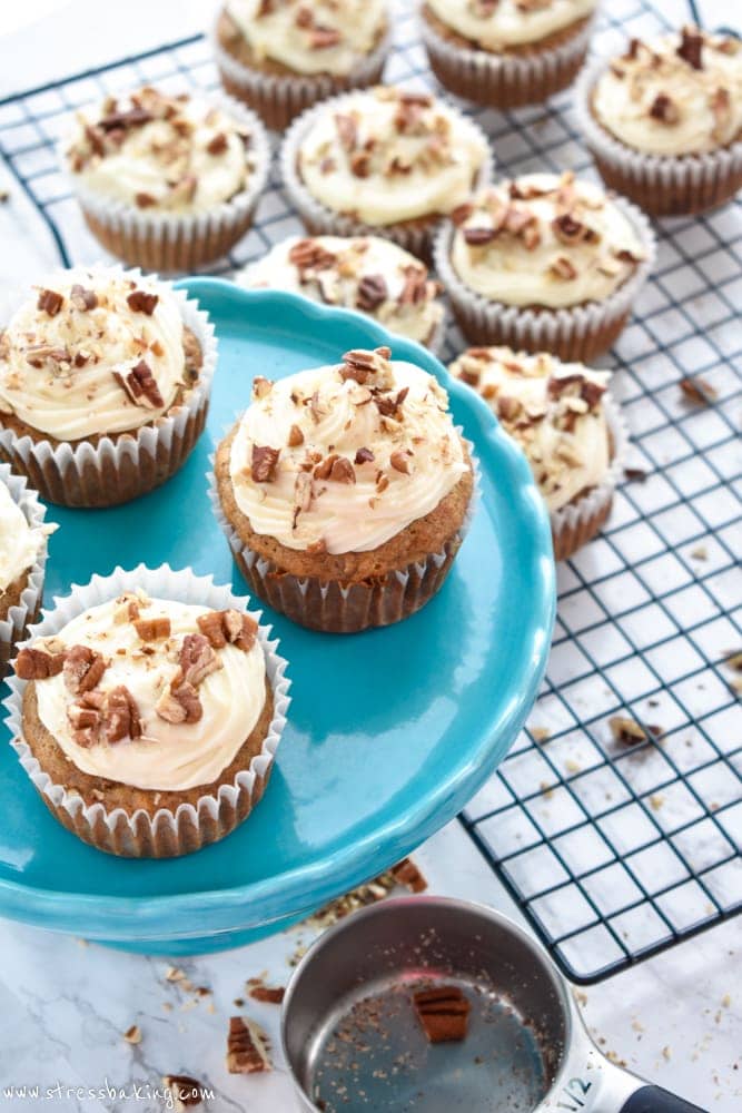 Hummingbird Cupcakes: Hummingbird cake is a classic southern favorite! I've made them into perfectly moist cupcakes filled with bananas, pineapple, and toasted pecans and topped with a tangy cream cheese frosting. | stressbaking.com #hummingbirdcake #banana #pineapple #cupcakes #creamcheese #frosting