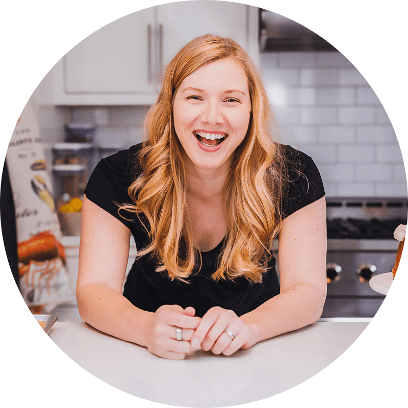 Leslie leaning on a counter
