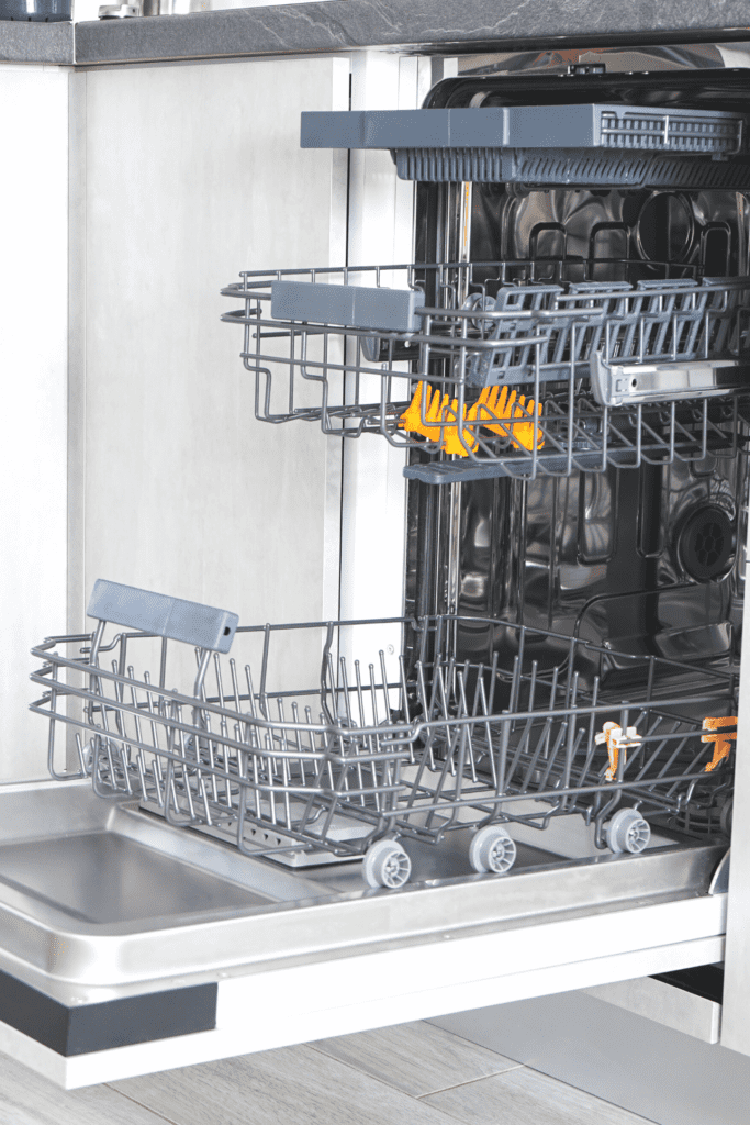An open dishwasher with the racks pulled out