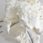Mascarpone whipped cream on a whisk