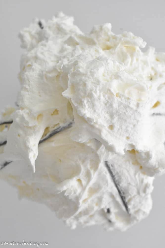 Overhead shot of mascarpone whipped cream on a whisk