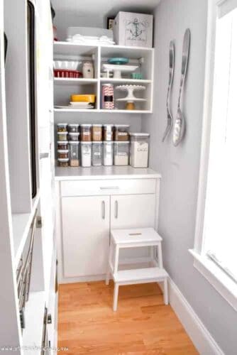 California Closets White pantry corner with white stool