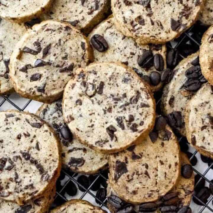 Chocolate chunk espresso cookies piled up with espresso beams