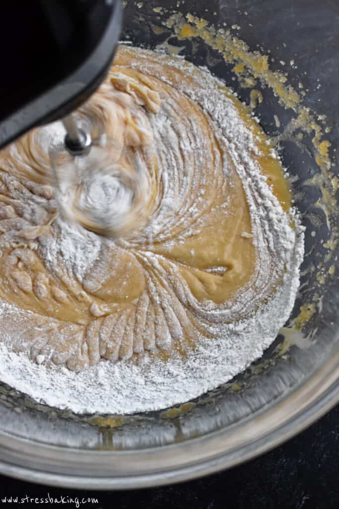 Flour being mixed in to cookie dough batter