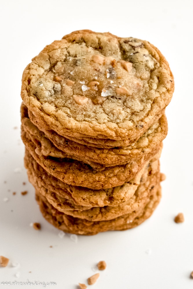 A large stack of Salted Brown Butter Toffee Chocolate Chunk Cookies