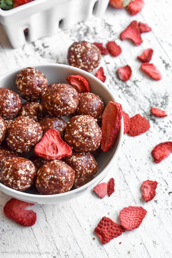 Strawberry Cashew Energy Bites in a bowl with freeze dried strawberries