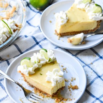 Key Lime Pie slices on a blue and white dish towel