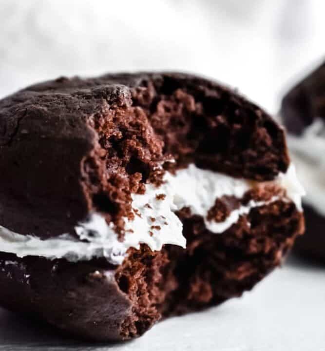 Chocolate whoopie pies with a bite taken out