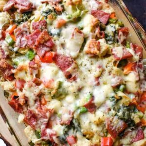 Overhead shot of colorful ham and cheese strata with peppers, spinach and cheese