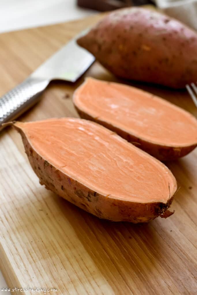 Sliced sweet potatoes on a cutting board