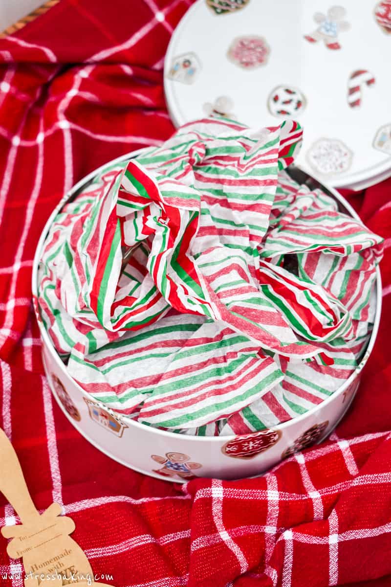 Festive tissue paper inside a holiday tin