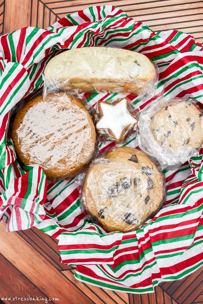 Cookies wrapped in plastic wrap in holiday striped tissue paper
