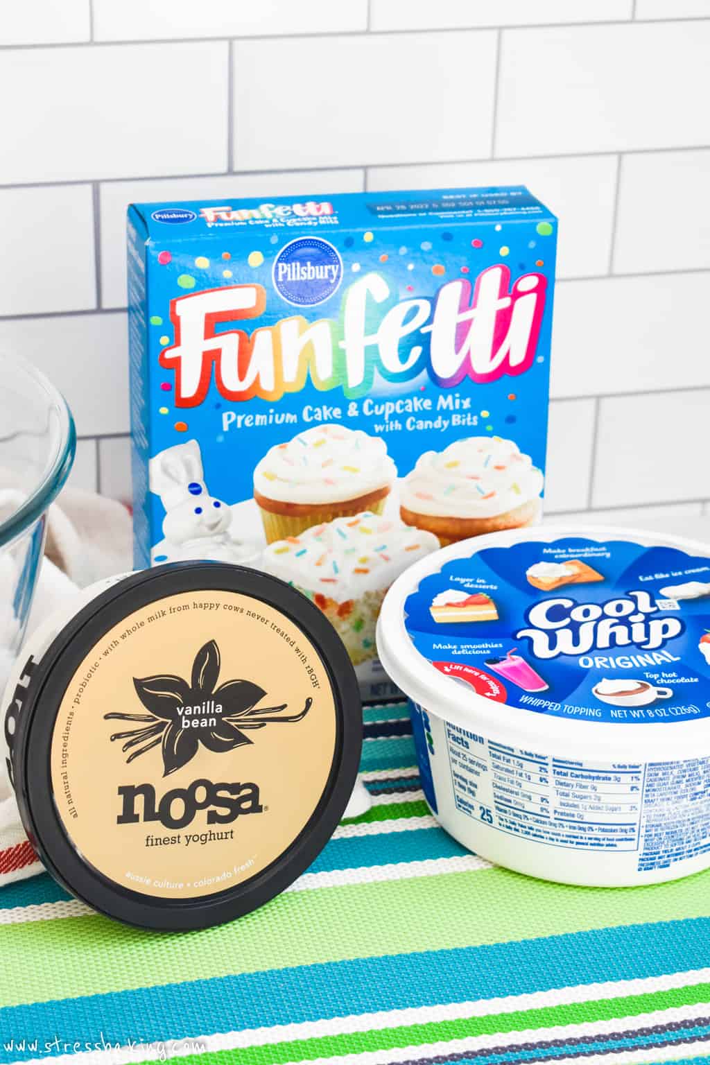 A box of funfetti cake mix, Noosa vanilla yogurt and Cool Whip