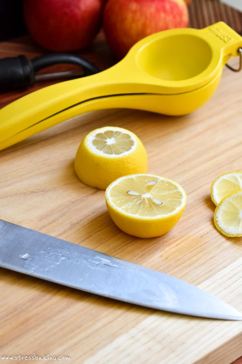 A sliced lemon on a cutting board
