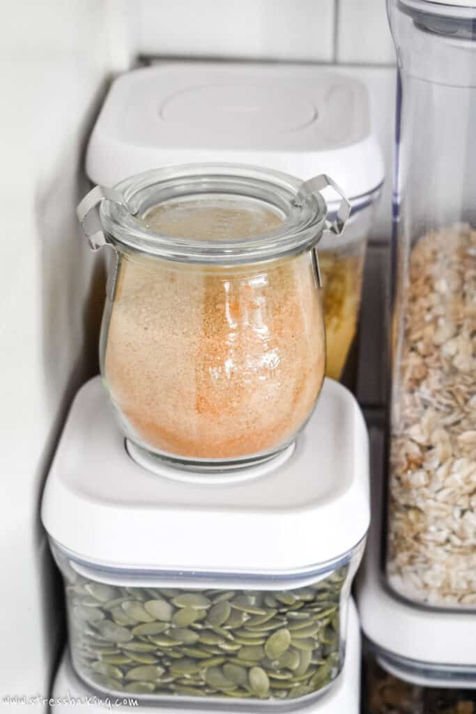 Cinnamon sugar in a glass jar stored in a corner