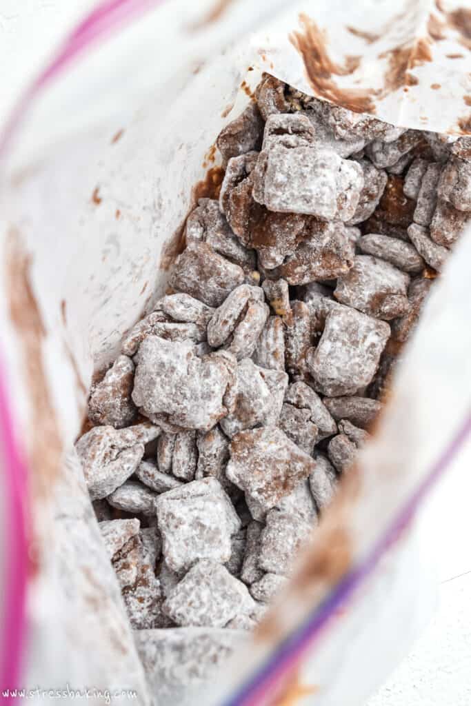A resealable bag full of powdered sugar coated puppy chow
