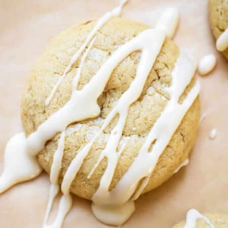 A maple sugar cookie with maple icing drizzled over the tops