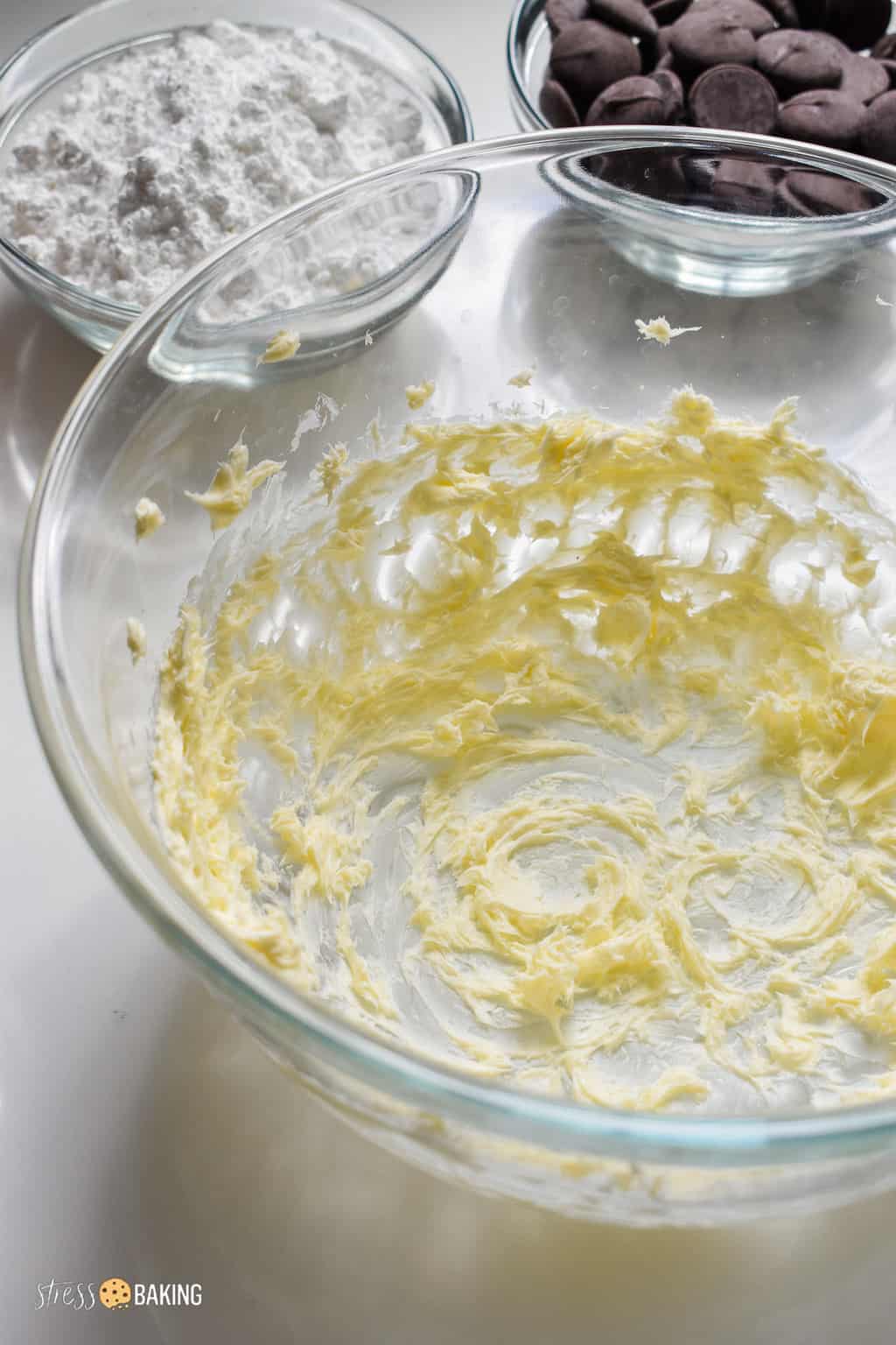 Creamed butter in a clear mixing bowl