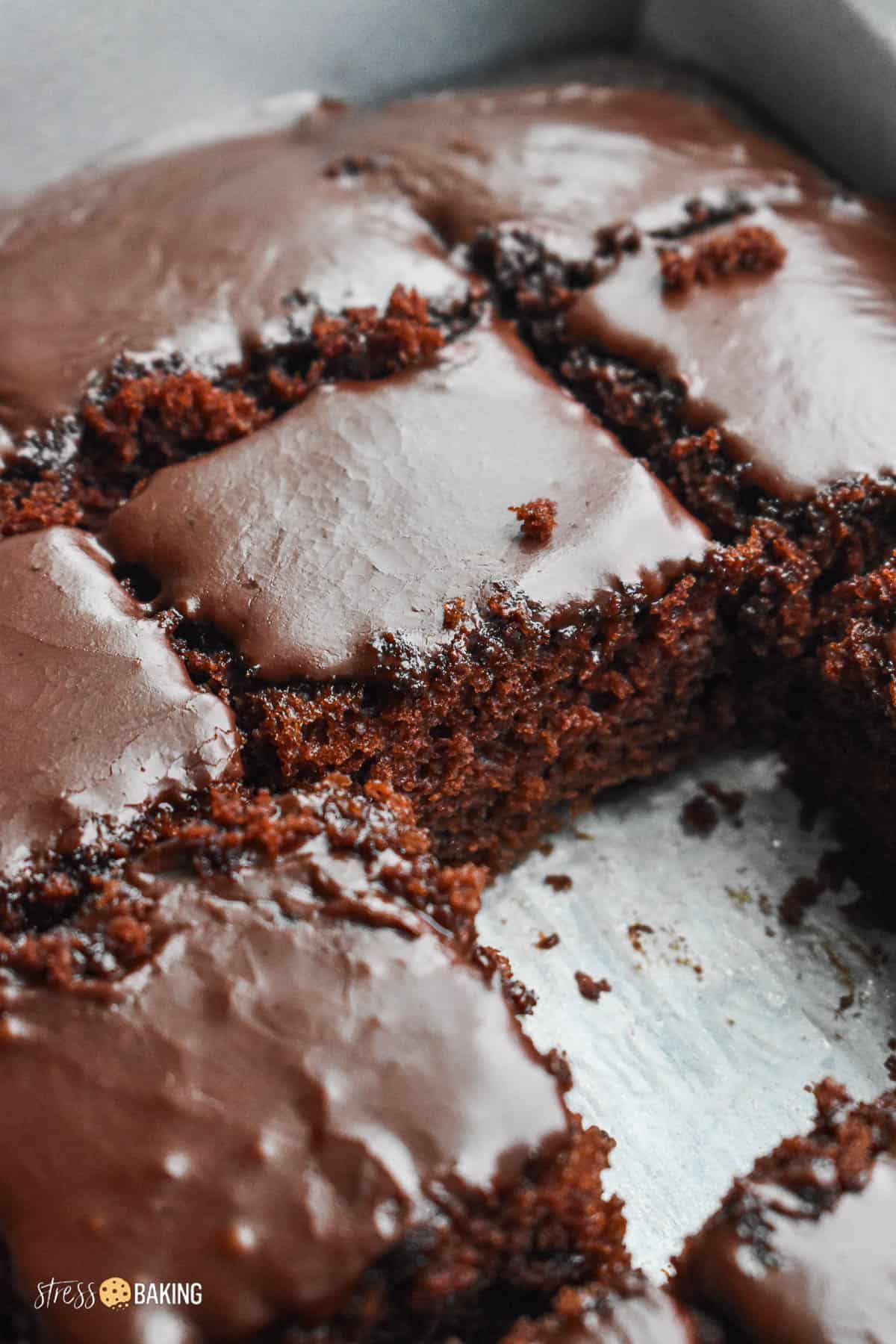 A close up of chocolate sheet cake with chocolate icing