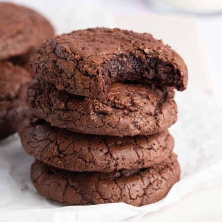 Stack of crinkly brownie cookies