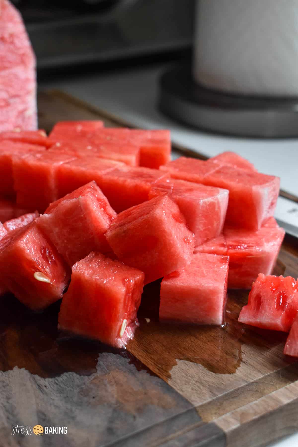 Bright red chopped watermelon on a chopping board